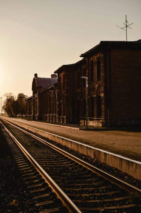 https://www.pexels.com/photo/train-station-building-beside-a-railroad-5501947/